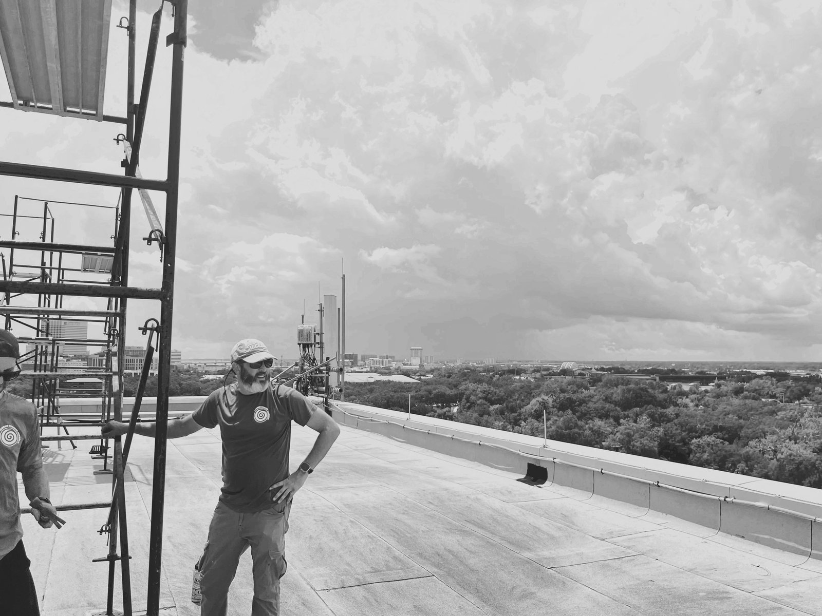 Nick Bruno on rooftop with city skyline