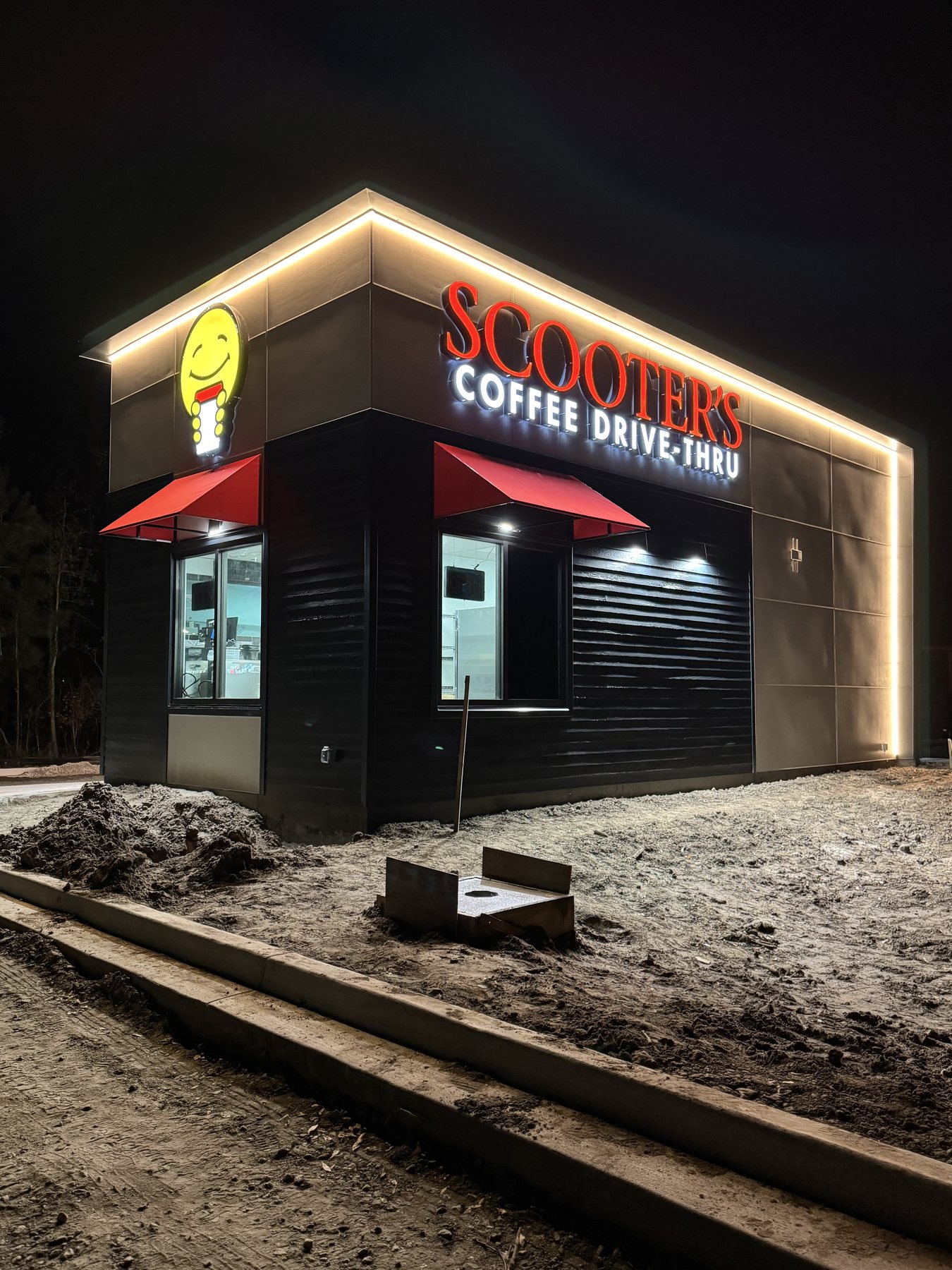 Scooter's Coffee illuminated storefront sign at night