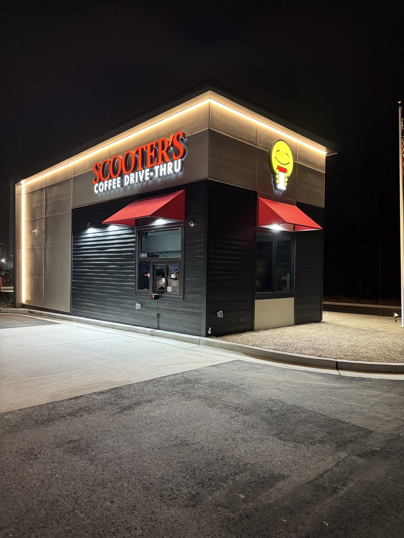Scooter's Coffee Drive-Thru illuminated channel letter sign at night